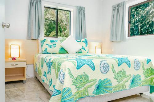Postel nebo postele na pokoji v ubytování Lagoon Breeze Villas
