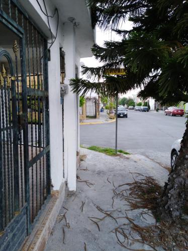 an entrance to a building with a gate and a street at Santa Rosa 4Rest in Monterrey