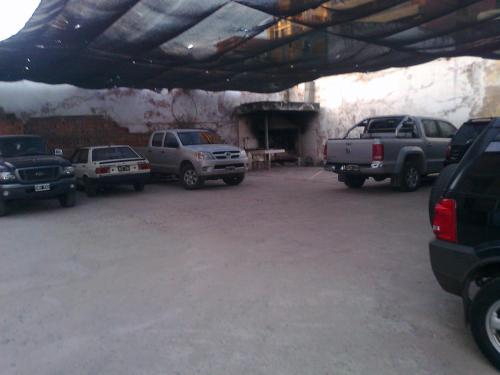 a group of cars parked in a parking lot at Hotel Miami in San Miguel de Tucumán