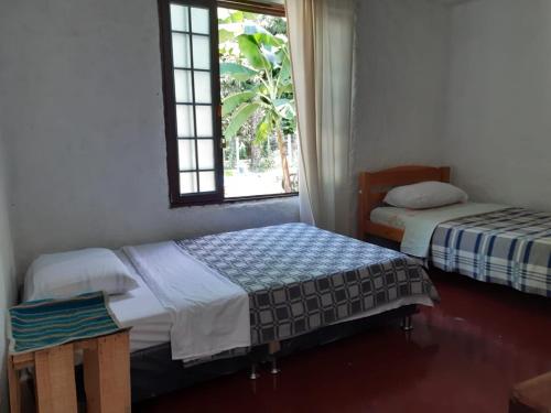 Posteľ alebo postele v izbe v ubytovaní Casa completa Bosque Ibagué