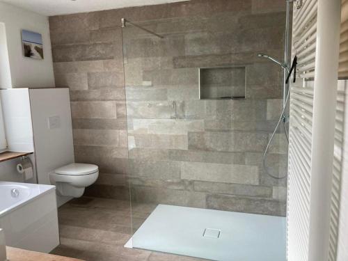 a bathroom with a shower and a toilet at Zur Mühle in Varel
