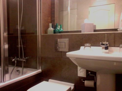 a bathroom with a sink and a shower and a toilet at The Craighaar Hotel in Aberdeen