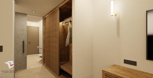a walk in wardrobe in a bathroom with a tv at Anaxo Resort in Riglia
