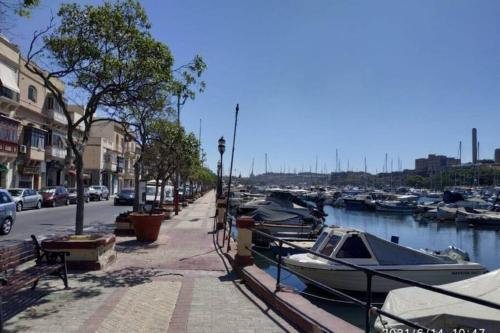 a group of boats are docked in a marina at Modern stylish flat near Valletta and Sliema! in Msida