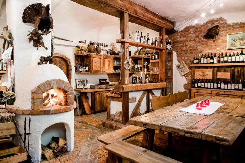 a room with a fireplace and a table and a oven at Villa Lieboch in Lieboch
