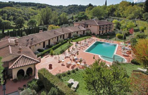 an aerial view of a house with a swimming pool at Hotel Sovestro in San Gimignano