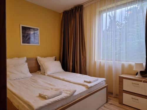 Ein Bett oder Betten in einem Zimmer der Unterkunft Kiara Apartments
