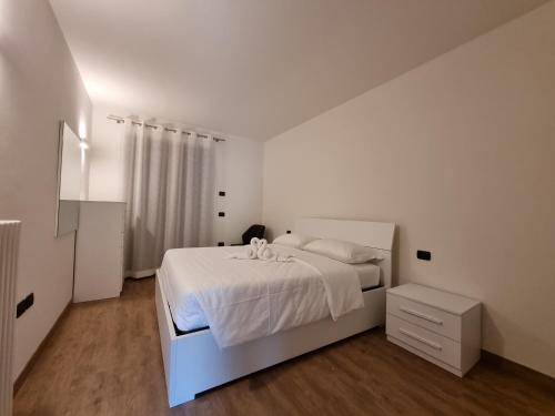 Postel nebo postele na pokoji v ubytování Tenno Appartamenti Garda Lake