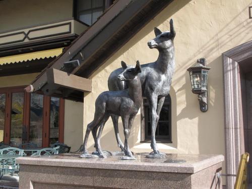 a statue of two horses standing on top of a building at Sun Valley Resort in Sun Valley