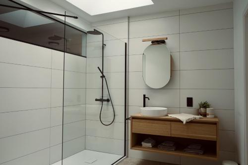 a bathroom with a shower and a sink at La Terrasse - Résidence Le Cercle in Marche-en-Famenne