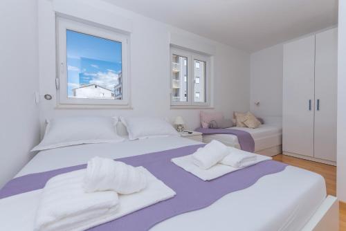 Posteľ alebo postele v izbe v ubytovaní Apartman Marla