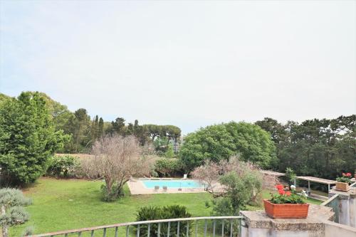 a view of a garden with a swimming pool at Relais Delle Rose in Lecce