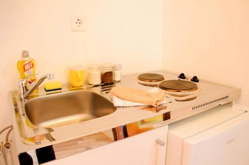 a kitchen with a sink and a counter top at Bungalows Fairy tale in Žabljak