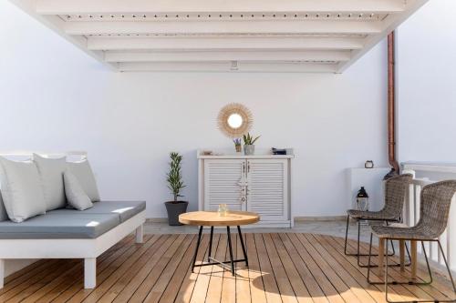 a living room with a couch and a table at Lindian Polis in Líndos