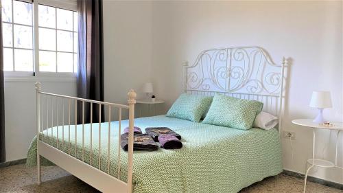 Ένα ή περισσότερα κρεβάτια σε δωμάτιο στο Apartamentos Los Arroyos