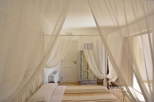 Postel nebo postele na pokoji v ubytování AGRITURISMO Masseria Spetterrata