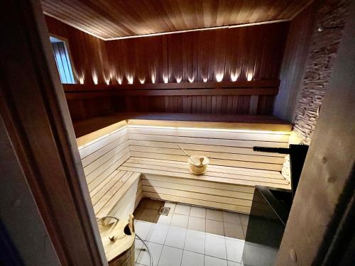 an empty sauna in a wooden room with at Dore in Lielvārde