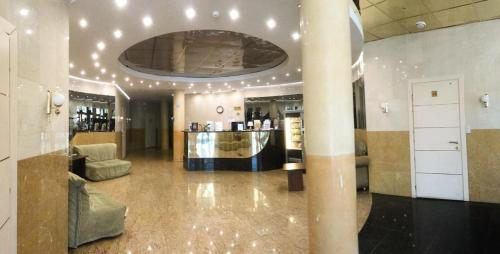 a lobby with a bar in a building at Hotel Kremlevsky in Ryazan