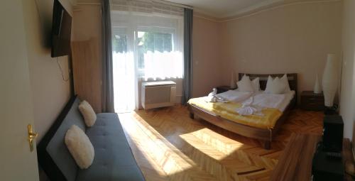 Posteľ alebo postele v izbe v ubytovaní Tücsök Apartman
