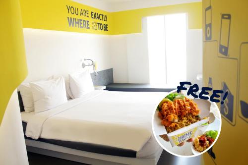 Postel nebo postele na pokoji v ubytování Yello Hotel Jemursari