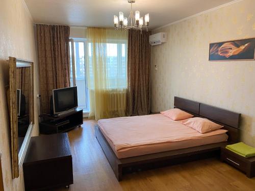 Cama o camas de una habitación en Apartments on Ryabikova