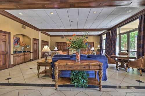 a living room with a blue couch and a table at Cozy Auburn Studio Less Than 1 Mile to University! in Auburn