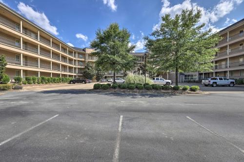 an empty parking lot in front of a large building at Cozy Auburn Studio Less Than 1 Mile to University! in Auburn