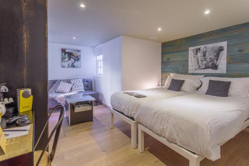 En eller flere senge i et værelse på Stay Central Hotel