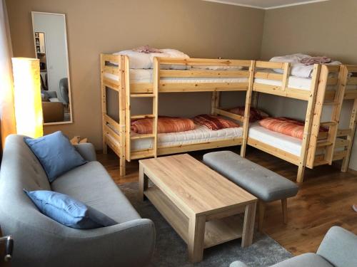 a living room with bunk beds and a couch at BUDE'55 Loft 14 in Winterberg