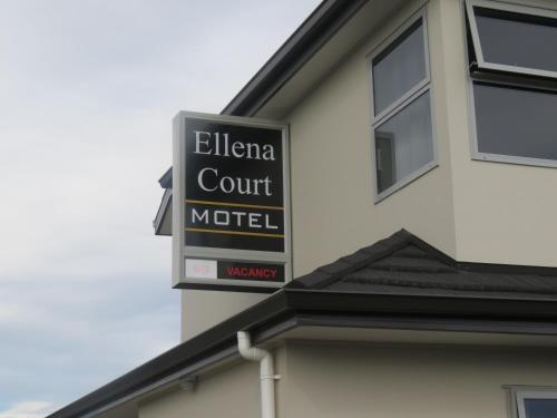 a sign for a hotel on the side of a building at Ellena Court Motel in Blenheim