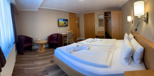 מיטה או מיטות בחדר ב-Hotel am Berg Oybin garni