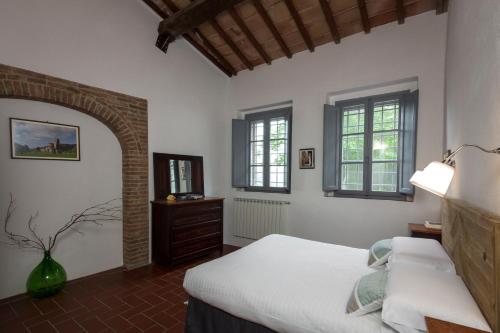 En eller flere senger på et rom på Tenuta della Selva