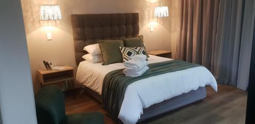 Ένα ή περισσότερα κρεβάτια σε δωμάτιο στο The Jackal Guesthouse