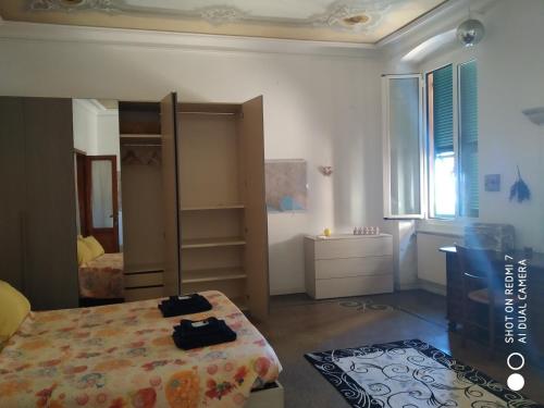 a bedroom with a bed and a desk at Nonna Lucia Holidays in Rapallo