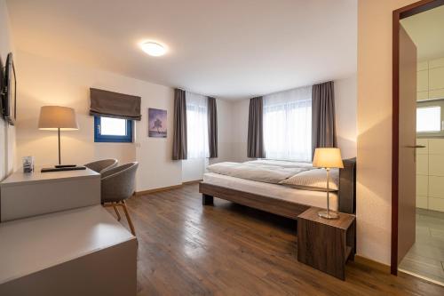Postel nebo postele na pokoji v ubytování Hotel Restaurant Alte Brauerei
