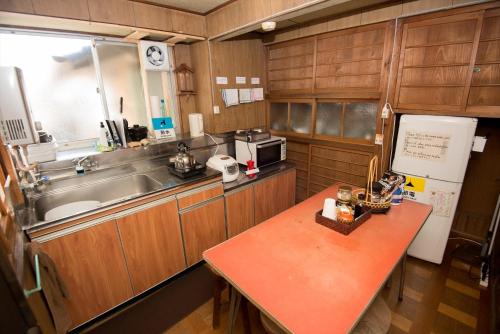 a small kitchen with a table and a sink at Kumano - Hotel - Vacation STAY 45689v in Kumano