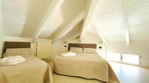 a bedroom with two beds in a room at Residence Altea in Riccione