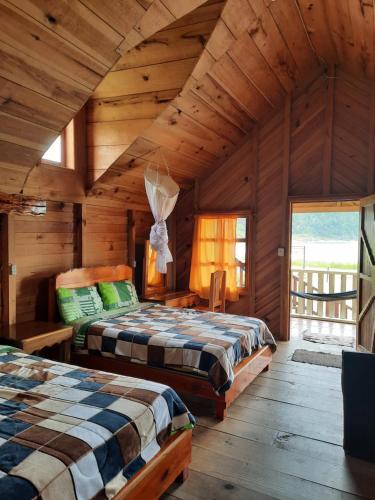 Ein Bett oder Betten in einem Zimmer der Unterkunft Cabañas Islas de Tziscao