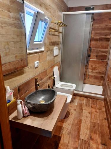 a bathroom with a sink and a toilet and a shower at Suite Natura Bed&Beauty Spa in Taranto