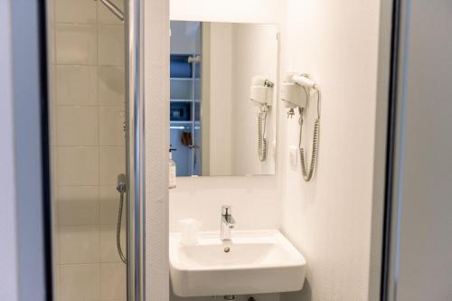 Ванная комната в Hotel Atlantique