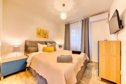 מיטה או מיטות בחדר ב-Villa Panorama Hill