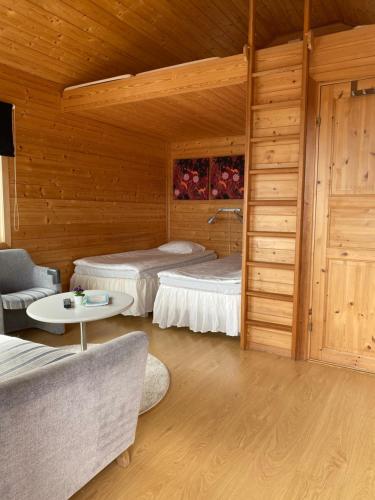 Postel nebo postele na pokoji v ubytování Visitor Stugby