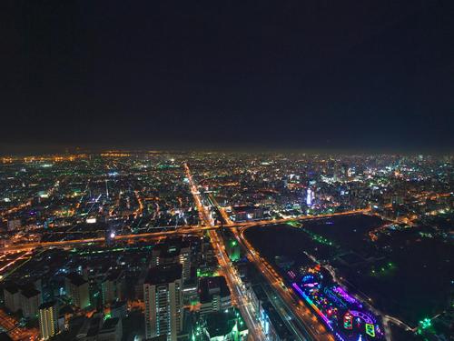 an aerial view of a city at night at Osaka Marriott Miyako Hotel in Osaka