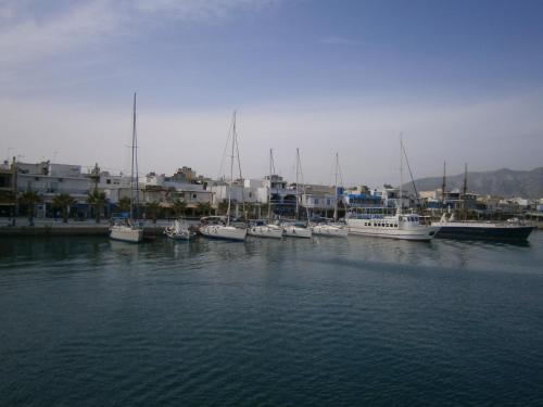 a group of boats are docked in a harbor at Amfi Apartments in Kardamaina