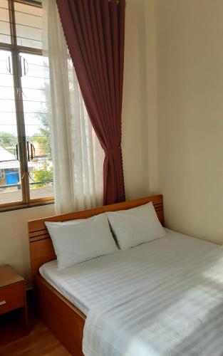 Katil atau katil-katil dalam bilik di Que Huong Coconut Hotel