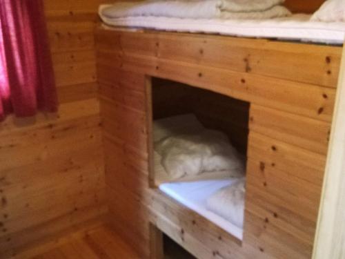 a dog house with a bed in it at 6 person holiday home in ENGAVÅGEN-By Traum in Åmnes
