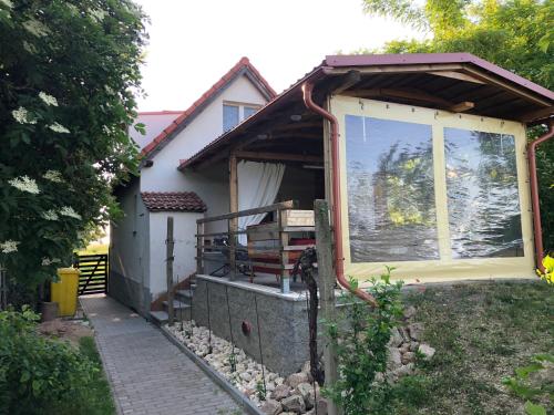 a house with a large window on the side of it at Sklípek-chatka Bella Moravia in Dobré Pole