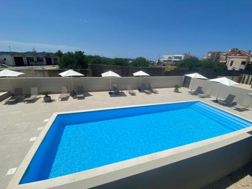 a swimming pool on the roof of a building at The View Luxury Residence with Pool in Zadar