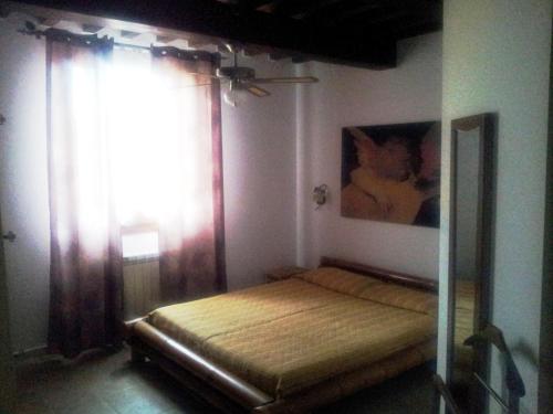 Un pat sau paturi într-o cameră la Agriturismo La Nocciolina
