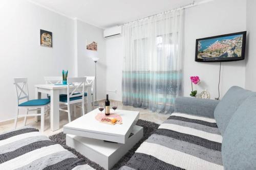 a living room with a couch and a table at Apartment Milos in Kotor